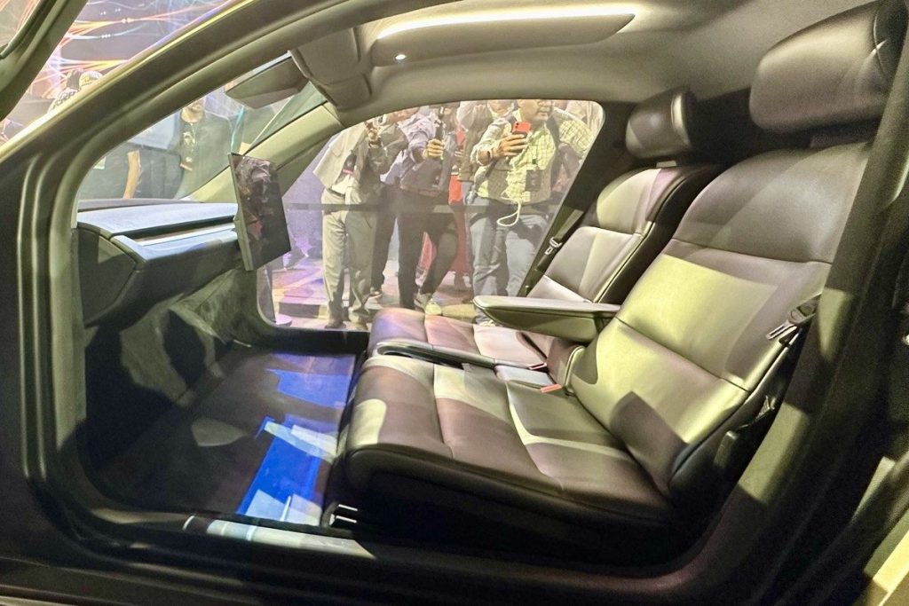 Cybercab cabin with two seats and no steering wheel or pedals